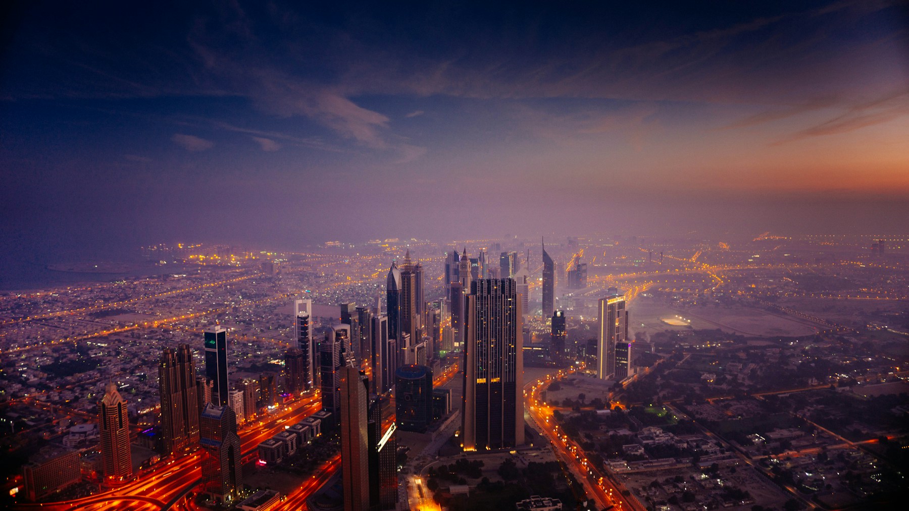 Dubai skyline and roads in warm sunrise light